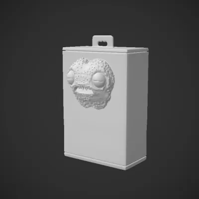 Green fuzzy monster toy in packaging. smooth edges, complex geometry, character.