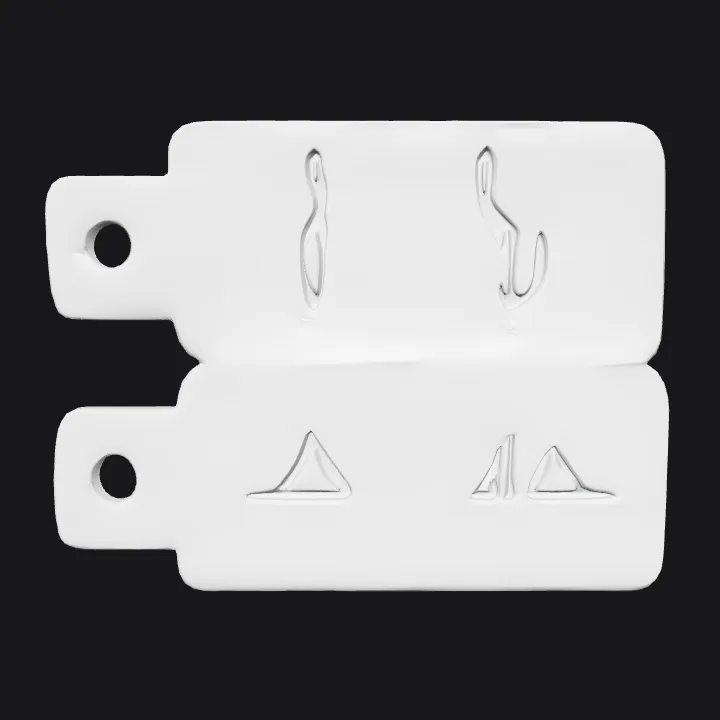 two metallic tags with engraved symbols. smooth edges, simple geometry, symmetric geometry.