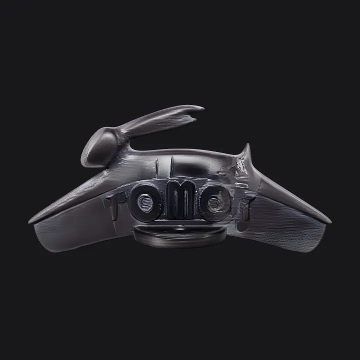 Dolphin-shaped object with TOMOS logo. smooth edges, simple geometry, symmetric geometry.