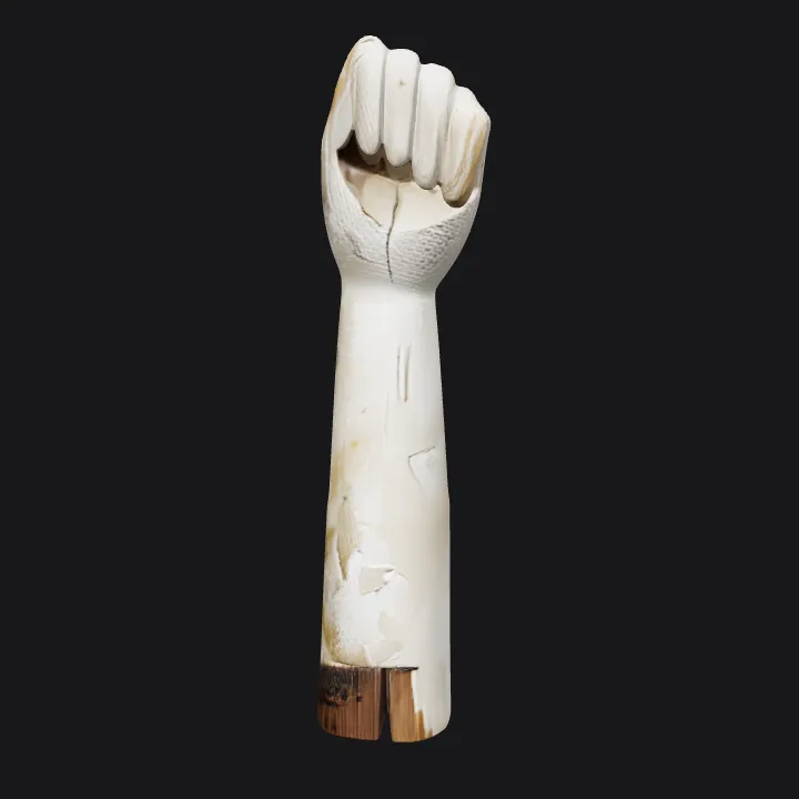 Wooden sculpture of a raised fist. sharp edges, complex geometry.
