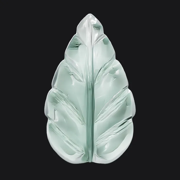 Green leaf-shaped glass ornament. smooth edges, simple geometry, symmetric geometry.